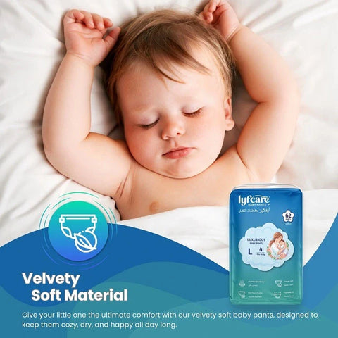 Close-up of a content baby sleeping peacefully on a white blanket, with a Lyfcare diaper pack, highlighting the "Velvety Soft Material" for ultimate comfort
