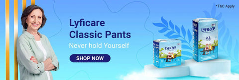 A bright blue banner featuring a smiling woman with folded arms next to two sizes (L and XL) of Lyfcare Classic Pants. The slogan says "Never hold Yourself" with a "Shop Now" button.