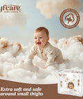 Baby sitting on fluffy clouds with Lyfcare baby pants packaging in the foreground