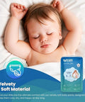 Baby sleeping with a package of lyfcares baby pants on a white background