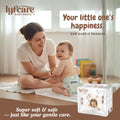 Woman and baby with lyfcare baby pants packaging in a room setting